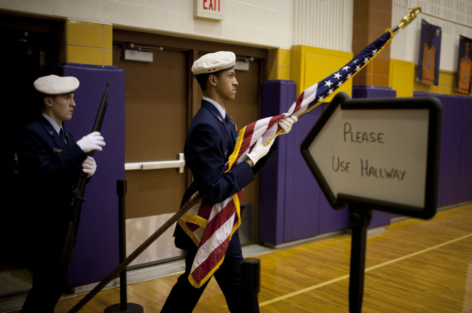 Color guard members walk the American Flag onto the court before the start of a high school basketball game between Clay and Elkhart Memorial on Tuesday, Feb. 21, 2012, at Clay High School in South Bend. (James Brosher/South Bend Tribune)
