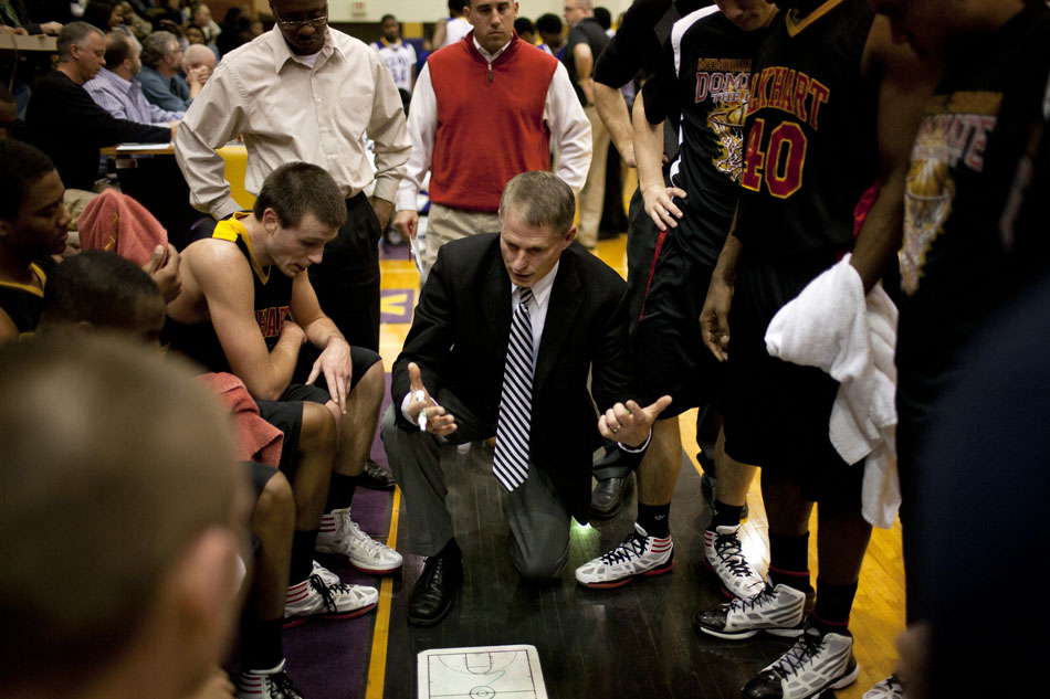 Elkhart Memorial coach Mark Barnhizer speaks to his team at the end of the third quarter during a high school basketball game against Clay on Tuesday, Feb. 21, 2012, at Clay High School in South Bend. (James Brosher/South Bend Tribune)