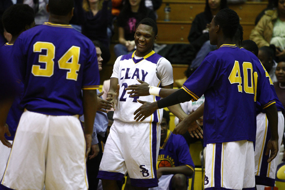 Clay's Jurod Wooden shares a laugh with his teammates as he is introduced as a starter during a high school basketball game on Tuesday, Feb. 21, 2012, at Clay High School in South Bend. (James Brosher/South Bend Tribune)
