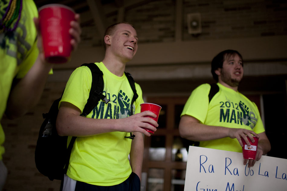 Jack Stumpf, a freshman from St. Louis, shares a laugh as he asks for donations during the annual Day of Man event on Wednesday, Feb. 15, 2012, outside of the north dining hall on the Notre Dame campus. Stumpf was one of several Siegfried Hall dorm residents to brave cold temperatures Wednesday wearing only t-shirts, shorts and shirts all day while collecting donations for the South Bend Homeless Shelter. (James Brosher/South Bend Tribune)