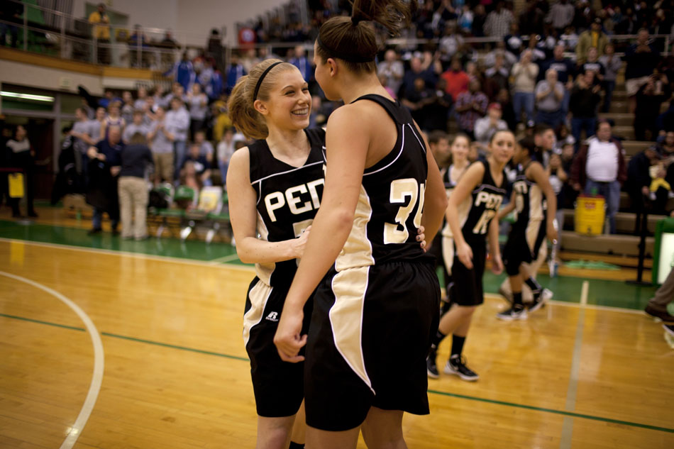 Penn players Alex Morton, left, celebrates with teammate Tori Milliner following a 59-55 win in a Class 4A basketball regional against Michigan City on Saturday, Feb. 18, 2012, at Valparaiso High School. (James Brosher/South Bend Tribune)