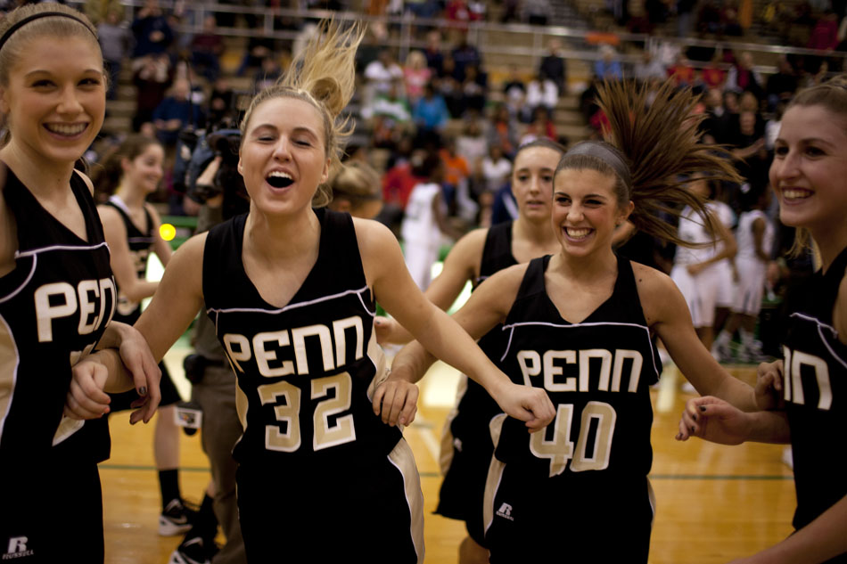 Penn players Alex Morton, left, Olivia Carlton (32), Lauren Ellenberger (40) and Taylor Lutz (10) celebrate following a 59-55 win in a Class 4A basketball regional against Michigan City on Saturday, Feb. 18, 2012, at Valparaiso High School. (James Brosher/South Bend Tribune)