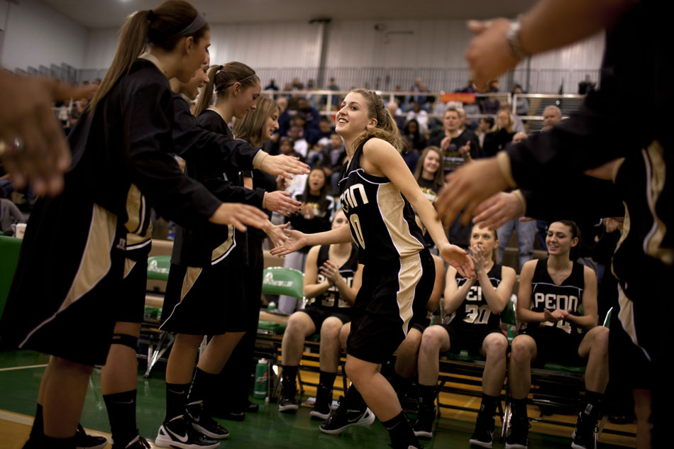 Penn's Taylor Lutz runs onto the court as she's introduced as a starter before a Class 4A basketball regional against Michigan City on Saturday, Feb. 18, 2012, at Valparaiso High School. Penn won 59-55. (James Brosher/South Bend Tribune)