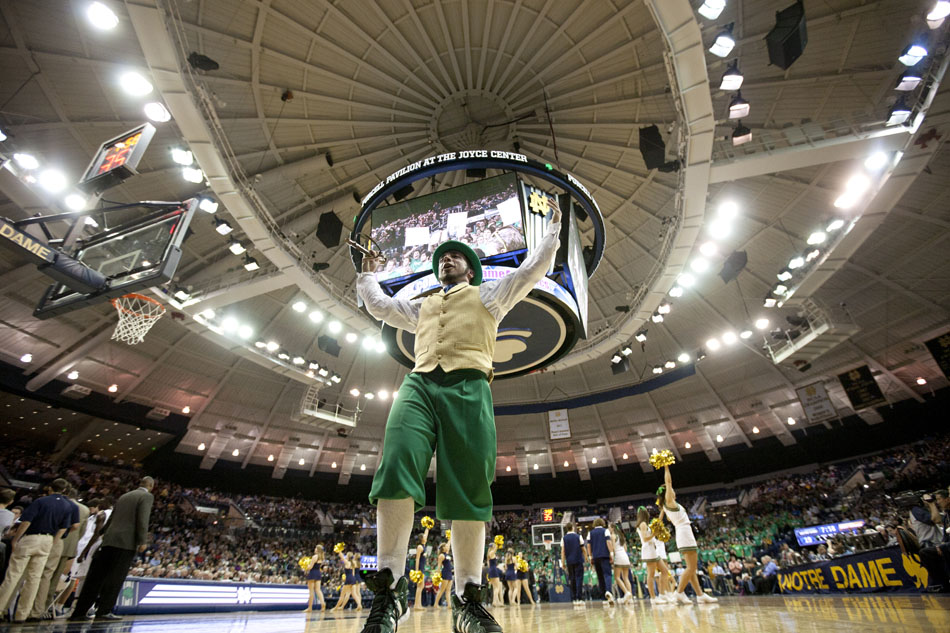 Mike George, dressed as the Notre Dame leprechaun mascot, pumps up the crowd during a break in a game between Notre Dame and West Virginia on Wednesday, Feb. 22, 2012, at the Purcell Pavilion in South Bend. (James Brosher/South Bend Tribune)