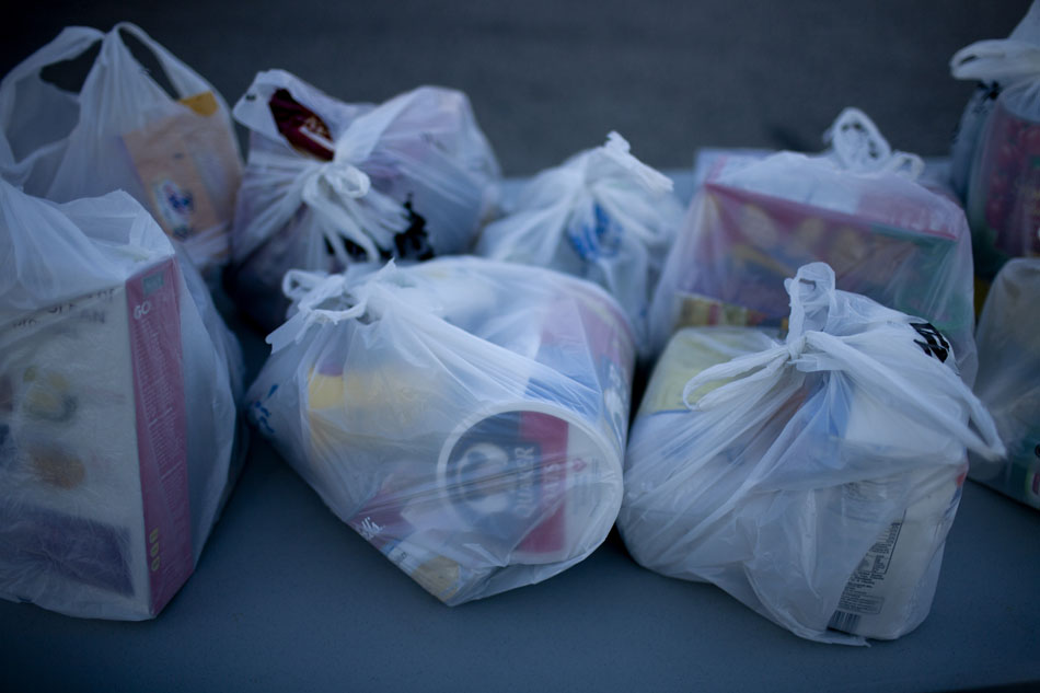 Bags of food donations sit on a table during the Neighbors in Need donation drive for the Food Bank of Northern Indiana on Monday, Feb. 20, 2012, morning at the WSBT studios in Mishawaka. (James Brosher/South Bend Tribune)