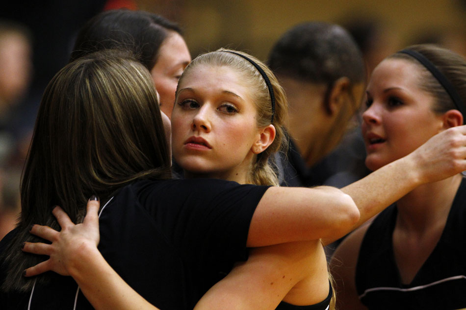 Penn's Alex Morton hugs a teammate after being subbed out of the game in the closing seconds of a 65-50 loss to North Central in the Class 4A girl's semi-state basketball game on Saturday, Feb. 25, 2012, at Warsaw High School. (James Brosher/South Bend Tribune)