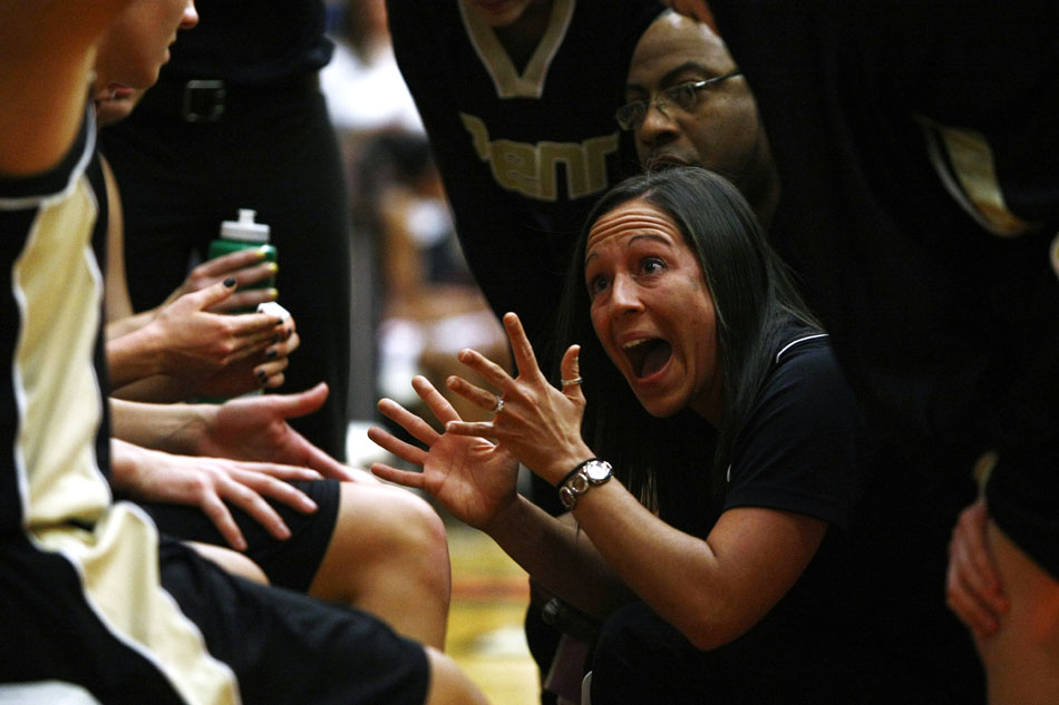 Penn coach Kristi Kaniewski talks to her players during a timeout in the Class 4A girl's semi-state basketball game on Saturday, Feb. 25, 2012, at Warsaw High School. (James Brosher/South Bend Tribune)