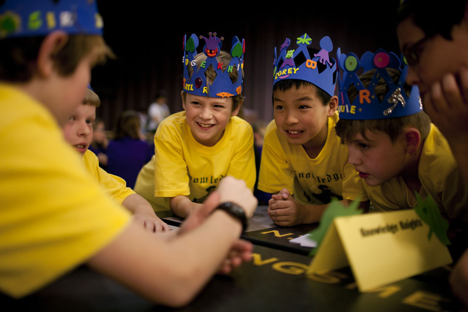 Taylor Stevens, center, 11, Corey Wang, 10, and Louie Thomas, 11, discuss a question with their team, the Knowledge Knights from Northpoint Elementary during the Battle of the Books on Wednesday, March 28, 2012, at Penn High School in Mishawaka. Several area fifth graders took part in the battle, answering questions from six chosen books. (James Brosher/South Bend Tribune)