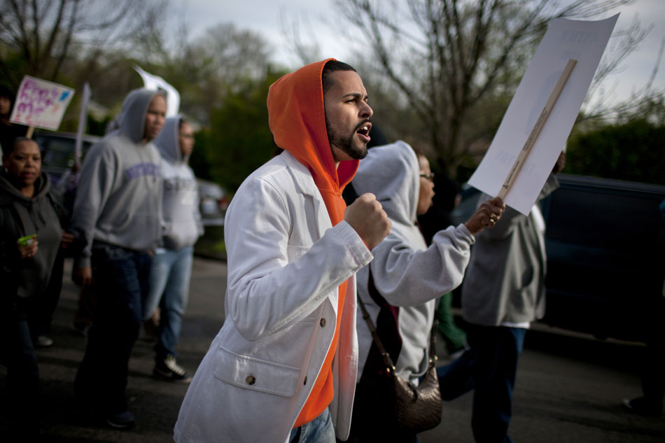 Dr. Kevin James, director of the Civil Rights Heritage Center in South Bend, chants as he and hundreds of hoodie-wearing participants march on Thursday, March 29, 2012, westward on Washington Street in South Bend. The march was part of the One Million Hoodie March nationwide marking the death of Travyon Martin, a teenager who was shot and killed while wearing a hoodie by a community watch volunteer in Sanford, Fla. last month. (James Brosher/South Bend Tribune)