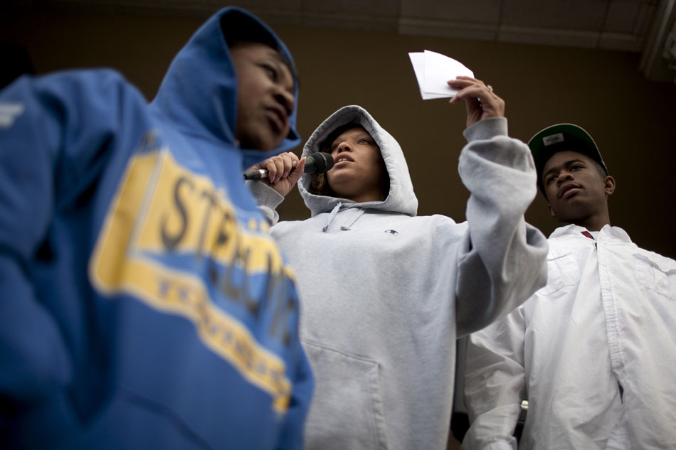 Regina Williams, center, leads the crowd in a chant before a hoodie march for slain teenager Trayvon Martin on Thursday, March 29, 2012, at the Civil Rights Heritage Center in South Bend. Martin was wearing a hoodie when he was shot and killed by a community watch volunteer in Sanford, Fla. last month. (James Brosher/South Bend Tribune)