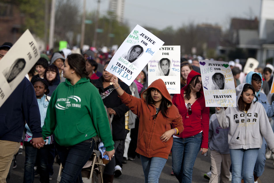 Participants make their way westward on Washington Street during a hoodie march for slain teenager Trayvon Martin on Thursday, March 29, 2012, in South Bend. Martin was wearing a hoodie when he was shot and killed by a community watch volunteer in Sanford, Fla. last month. (James Brosher/South Bend Tribune)