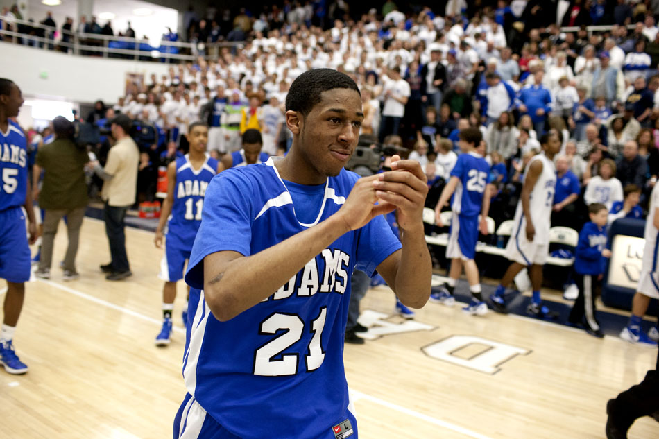 Adams' Stevie Thomas claps as he walks off the court after an 76-72 upset of Lake Central in a Class 4A basketball regional semi-final on Saturday, March 10, 2012, at Michigan City High School. (James Brosher/South Bend Tribune)