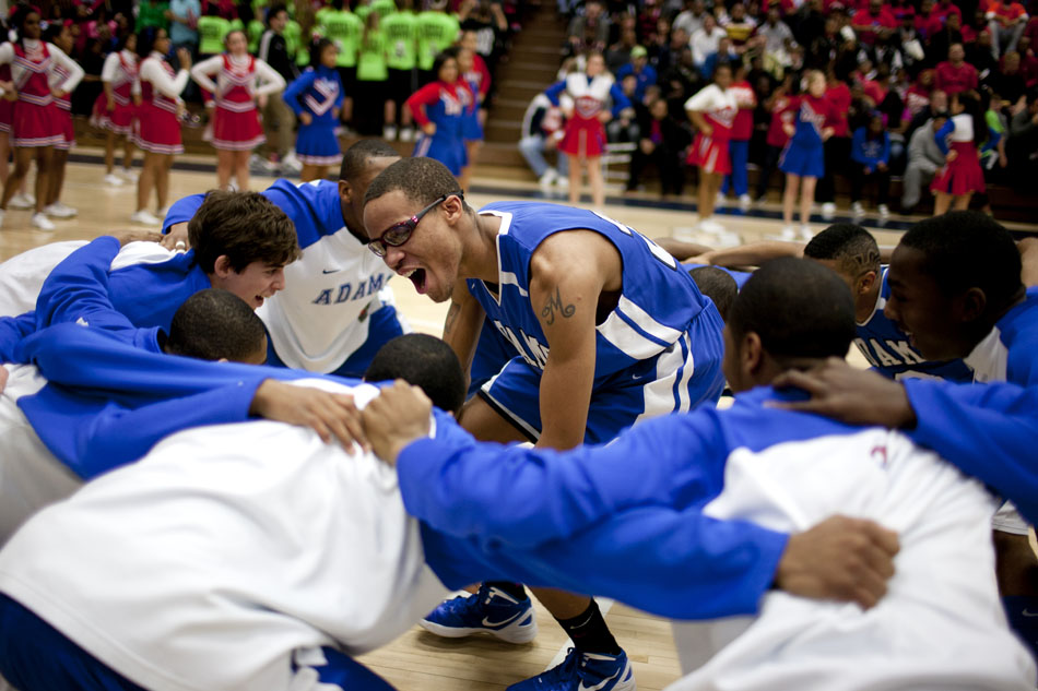 Adams' Nolan Montgomery gets the team pumped before a Class 4A basketball regional semi-final on Saturday, March 10, 2012, at Michigan City High School. (James Brosher/South Bend Tribune)