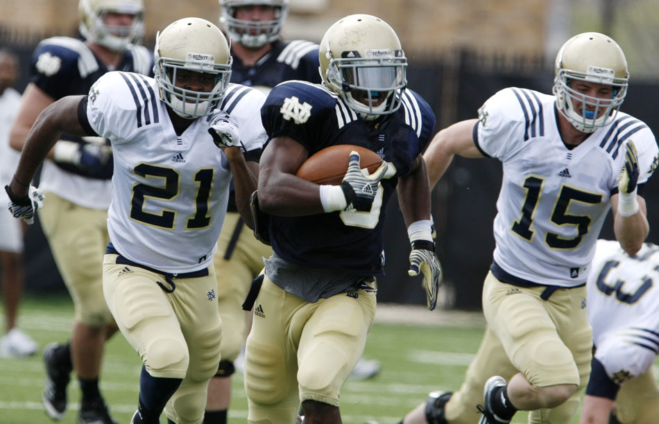 Notre Dame running back Theo Riddick breaks off a long run during a spring football practice on Saturday, March 24, 2012, at the LaBar practice fields. (James Brosher/South Bend Tribune)