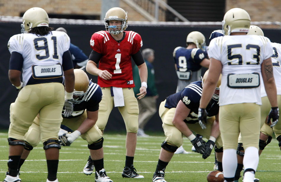 Notre Dame quarterback Gunner Kiel smiles as he runs the offense during a spring football practice on Saturday, March 24, 2012, at the LaBar practice fields. (James Brosher/South Bend Tribune)