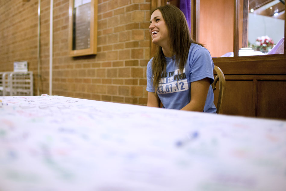 Kelly Gibson, a senior at Notre Dame, interacts with a passing student as she encourages them to sign a pledge to stop using the word "retarded" in a harmful context on Wednesday, March 7, 2012, at Notre Dame's South Dining Hall. The pledge drive is part of End the R-Word Day, a national drive on some 230 universities. The effort at Notre Dame was sponsored by the Special Olympics Notre Dame and Best Buddies organizations. (James Brosher/South Bend Tribune)