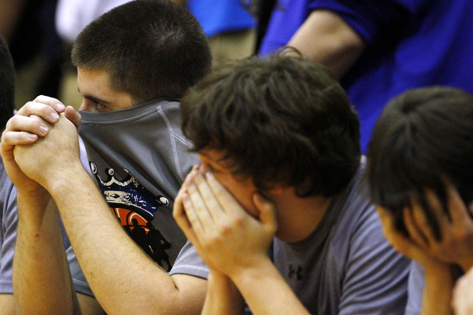 The Mishawaka Marian bench watches the closing seconds of a 76-67 loss to Norwell in a Class 3A semistate on Saturday, March 17, 2012, at Huntington North High School in Huntington, Ind. (James Brosher/South Bend Tribune)