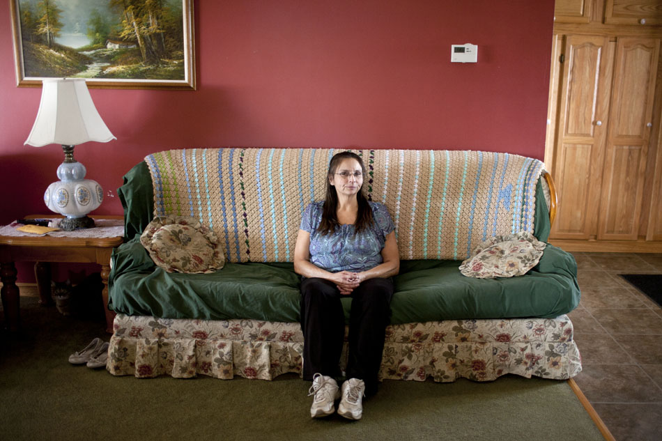 Tina Tabler sits for a portrait on Wednesday, March 7, 2012, at her South Bend home. Tabler was shot twice, but narrowly escaped death at the the Bertrand Products shootings ten years ago. (James Brosher/South Bend Tribune)