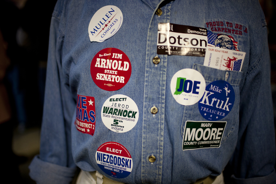 A supporter wears stickers supporting Democratic candidates during Dyngus Day on Monday, April 9, 2012, at the West Side Democratic Club in South Bend.