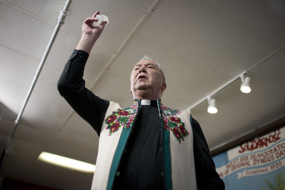 The Rev. Leonard Chrobot blesses the crowd during Dyngus Day on Monday, April 9, 2012, at the West Side Democratic Club in South Bend.