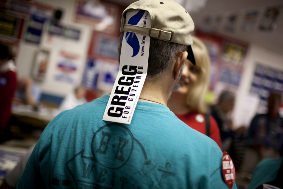 A John Gregg supporter wears a bumper sticker in his hat during Dyngus Day on April 9, 2012, at the West Side Democratic Club in South Bend. Gregg, a Democrat, is running for Indiana governor.