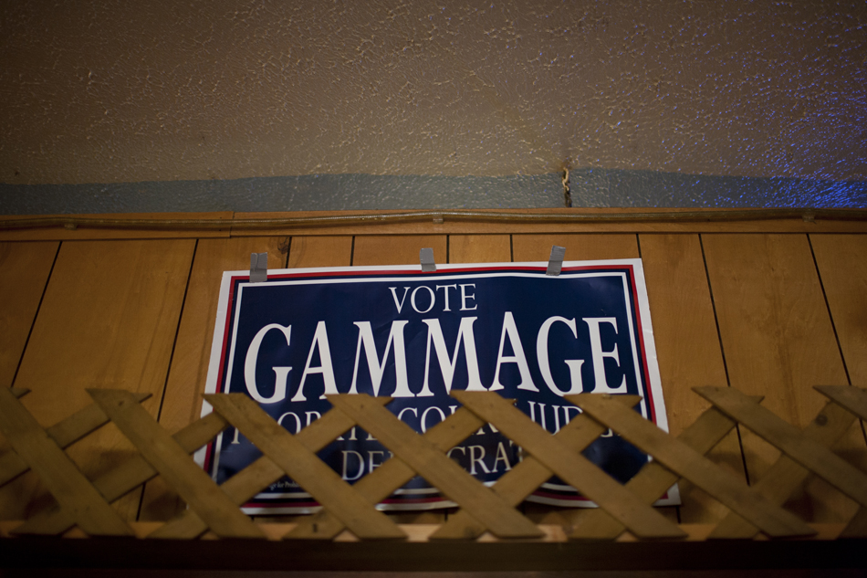 A sign for Andre Gammage, a candidate for probate court judge, adorns a wall above the bar during a Solidarity Day event on Monday, April 9, 2012, at Elks Lodge No. 298 in South Bend. Donnelly is running for Indiana's U.S. Senate seat currently held by Republican incumbent Richard Lugar.