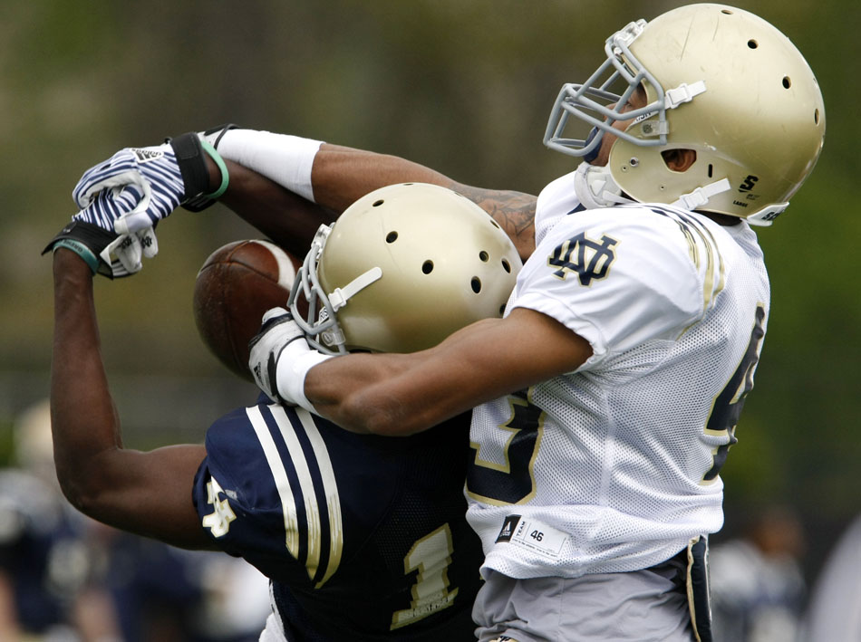 Notre Dame cornerback Josh Atkinson, right, breaks up a pass intended for wide receiver DaVaris Daniels during a football practice on Saturday, April 14, 2012, at Notre Dame. (James Brosher/South Bend Tribune)