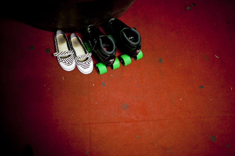 A pair of shoes and a pair of skates await a derby girl before a South Bend Roller Girls practice on Thursday, April 12, 2012, at USA Skate Center in Mishawaka. (James Brosher/South Bend Tribune)