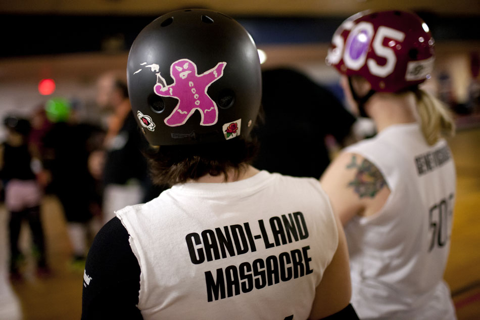 Candice Mansfield, "Candi-Land Massacre," wears a helmet featuring a gingerbread man throwing a Molotov cocktail during South Bend Roller Girls practice on Thursday, April 12, 2012, at USA Skate Center in Mishawaka. (James Brosher/South Bend Tribune)