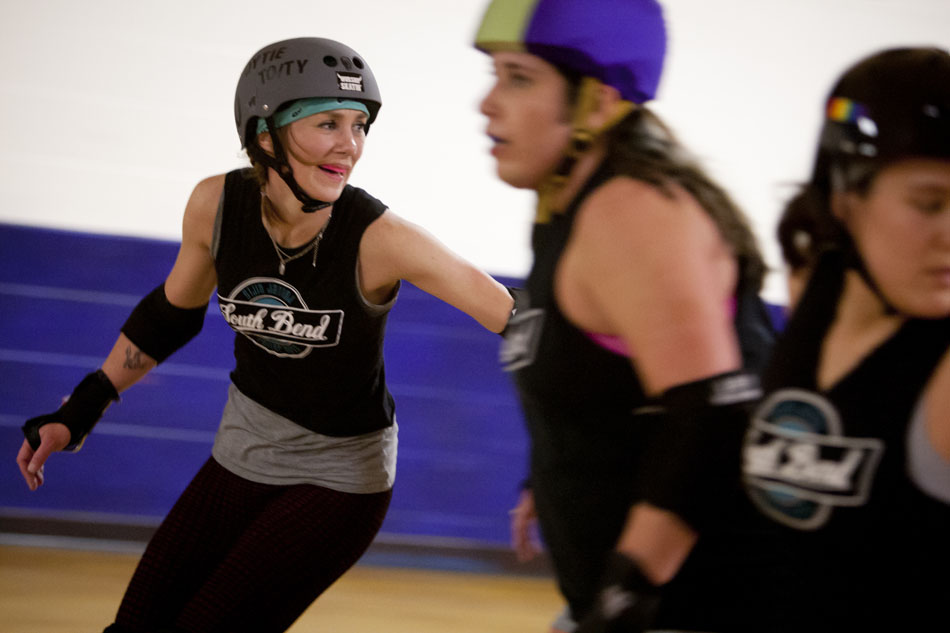 Shannon Hoyt, "Hoytie Toity," smiles as she takes part in a drill during a practice of the South Bend Roller Girls on Thursday, April 12, 2012, at USA Skate Center in Mishawaka. The idea for the team started two years ago when Hoyt, 32, posted on her Facebook asking friends if anyone was interested in starting a derby team. (James Brosher/South Bend Tribune)