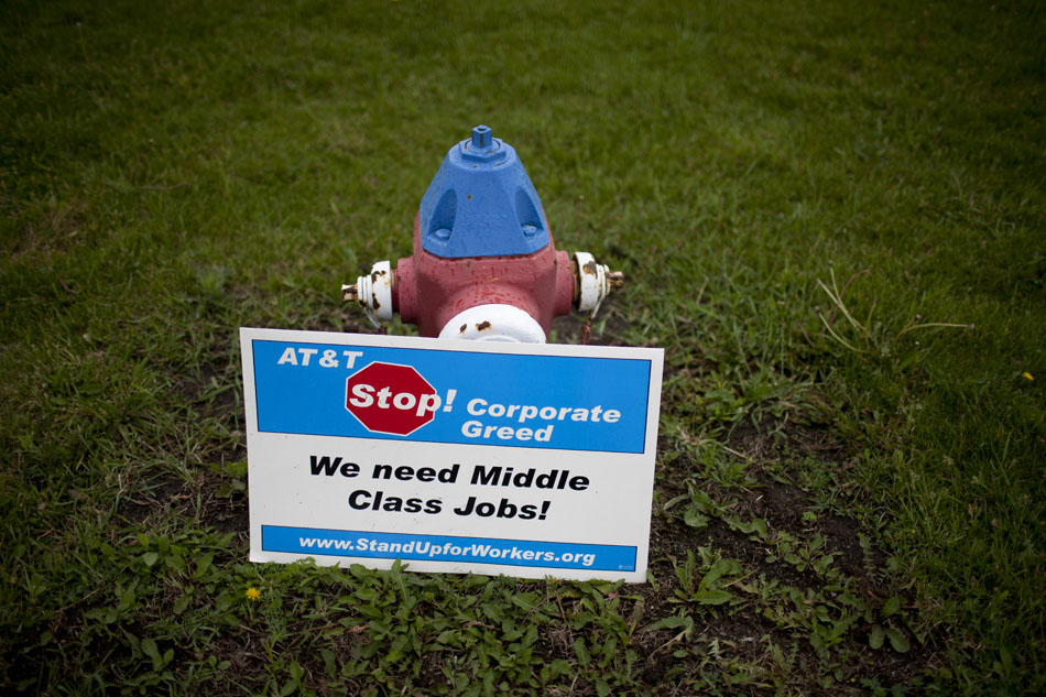 A Communication Workers of America Local 4900 sign rests against a fire hydrant during a solidarity strike against AT&T on Monday, May 7, 2012, outside of the AT&T warehouse on Cleveland Road. The strike was to show support for a grievance strike in Anderson, Ind. (James Brosher/South Bend Tribune)