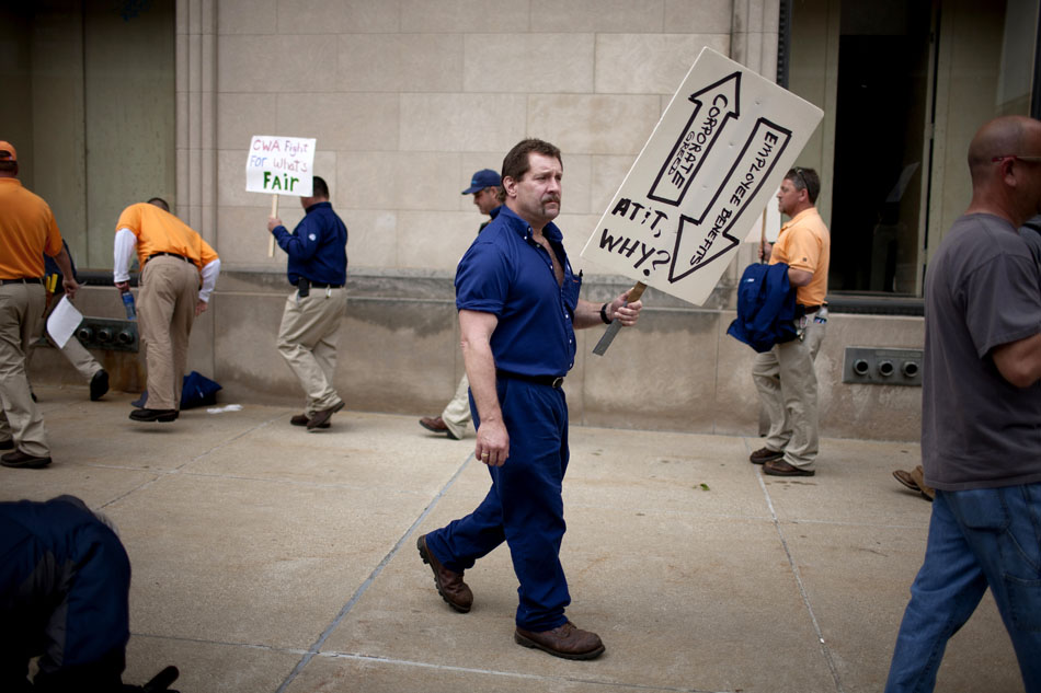 A man, who would only identify himself as Willie, walks during a Communication Workers of America Local 4900 solidarity strike on Monday, May 7, 2012, at the AT&T building in downtown South Bend. (James Brosher/South Bend Tribune)