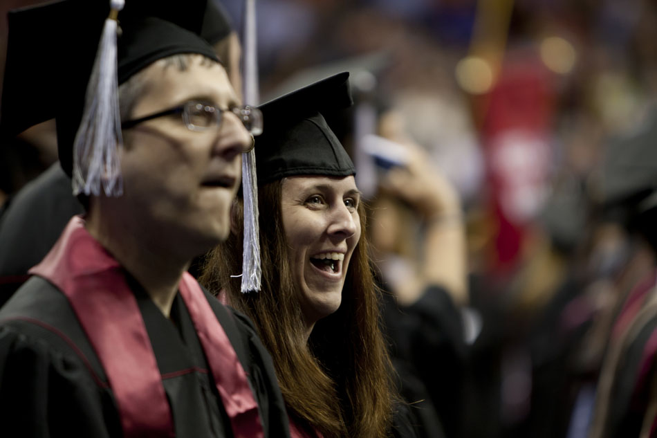 A soon-to-be graduate shares a laugh during Indiana University-South Bend commencement exercises on Tuesday, May 8, 2012, in the Purcell Pavilion at Notre Dame. (James Brosher/South Bend Tribune)