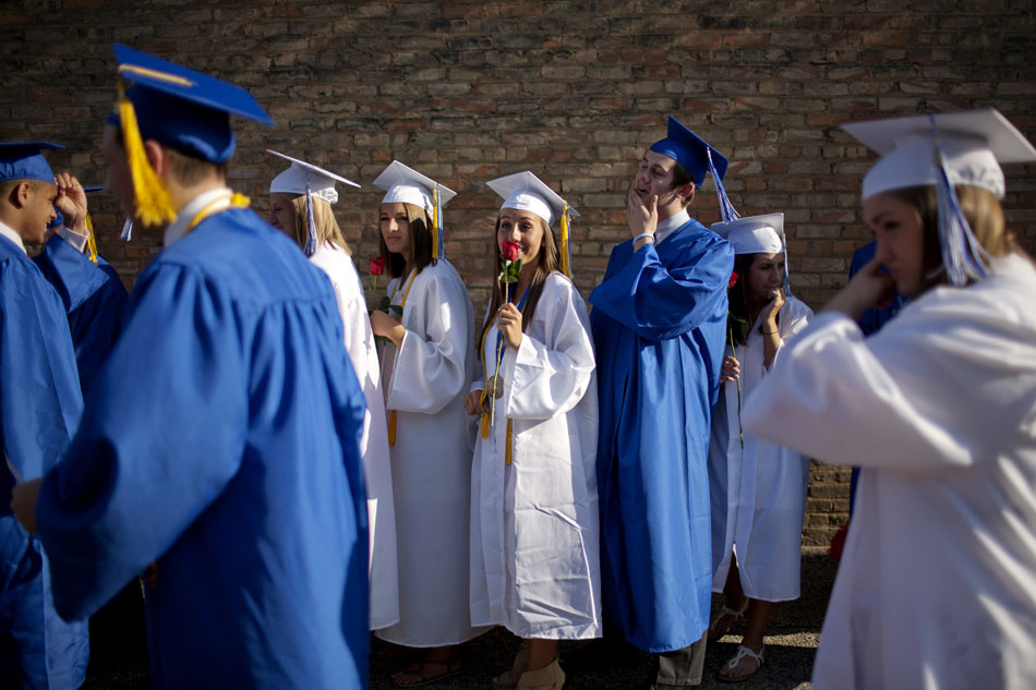 Students wait outside the theater before the start of Marian High School commencement exercises on Friday, May 25, 2012, at the Morris Performing Arts Center in South Bend. (James Brosher/South Bend Tribune)