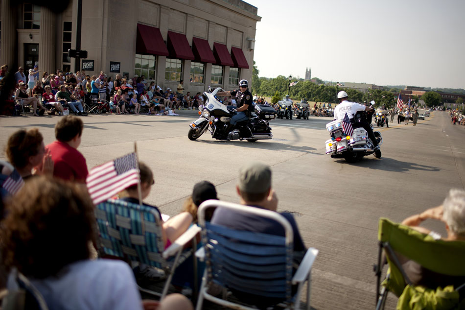 South Bend motorcycle police circle the intersection of Main Street and Mishawaka Avenue as they lead a Memorial Day parade on Monday, May 28, 2012, in Mishawaka. (James Brosher/South Bend Tribune)