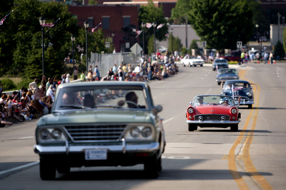 A procession of classic cars make their way north across the Main Street bridge during a Memorial Day parade on Monday, May 28, 2012, in Mishawaka. (James Brosher/South Bend Tribune)