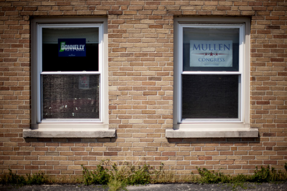 Campaign signs for U.S. Rep. Joe Donnelly, who is running for the U.S. Senate, and Brendan Mullen, running for Donnelly's 2nd Congressional district seat, hang in windows during a "Workhorse Tour" stop on Saturday, May 19, 2012, at UAW Local 9 in South Bend. (James Brosher/South Bend Tribune)