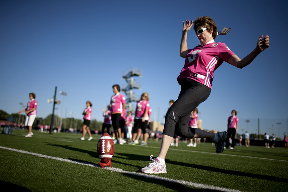 A participant watches a field goal attempt during a Football 101 clinic on Tuesday, June 12, 2012, at Notre Dame. The clinic for women was hosted by the Kelly Cares Foundation with proceeds going to breast cancer prevention and awareness. (James Brosher/South Bend Tribune)