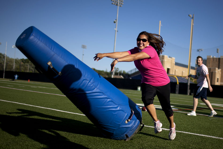 Norma Coronado-Ortiz of South Bend takes down an obstacle during a defensive drill in a Football 101 clinic on Tuesday, June 12, 2012, at Notre Dame. (James Brosher/South Bend Tribune)