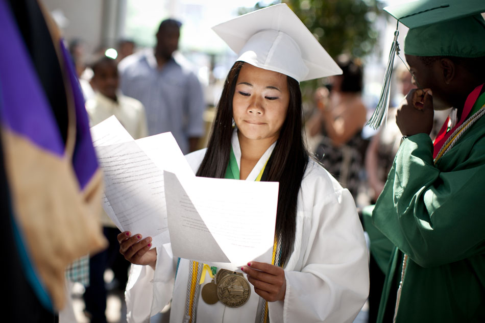 Monica Chan, one of the Washington High School's two valedictorians, looks over her speech as she and her fellow graduates prepare to march into commencement exercises on Saturday, June 9, 2012, at the Century Center in downtown South Bend. (James Brosher/South Bend Tribune)