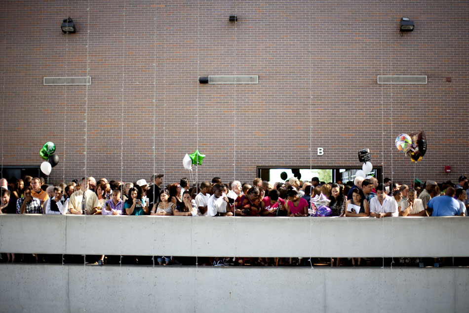 Audience members watch from a balcony as graduates march from the ceremony back to a dressing area after Washington High School commencement exercises on Saturday, June 9, 2012, at the Century Center in downtown South Bend. (James Brosher/South Bend Tribune)