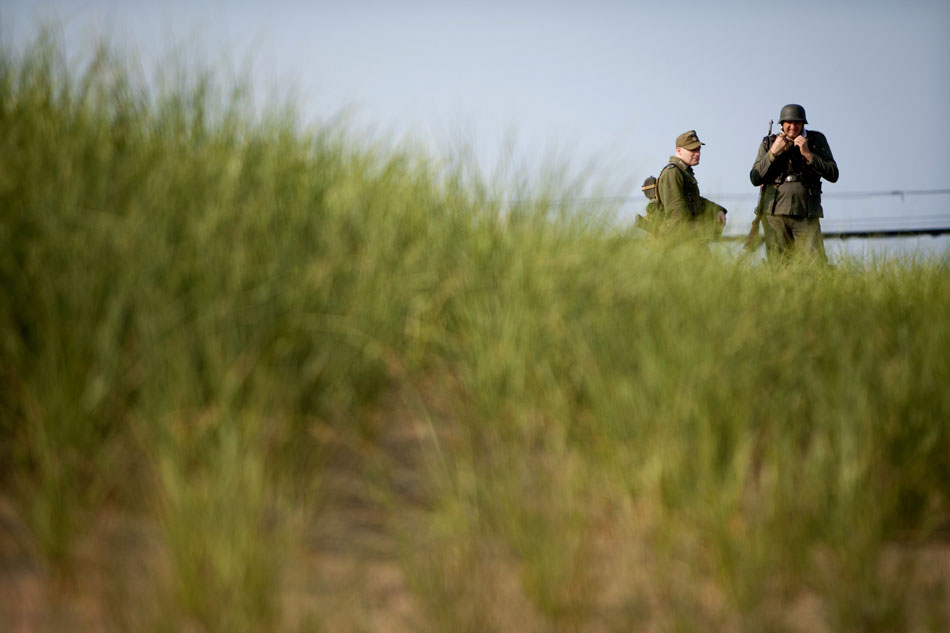 German troops prepare for an Allied invasion during a WWII re-enactment on Saturday, June 30, 2012, at Tiscornia Beach in St. Joseph, Mich. (James Brosher/South Bend Tribune)