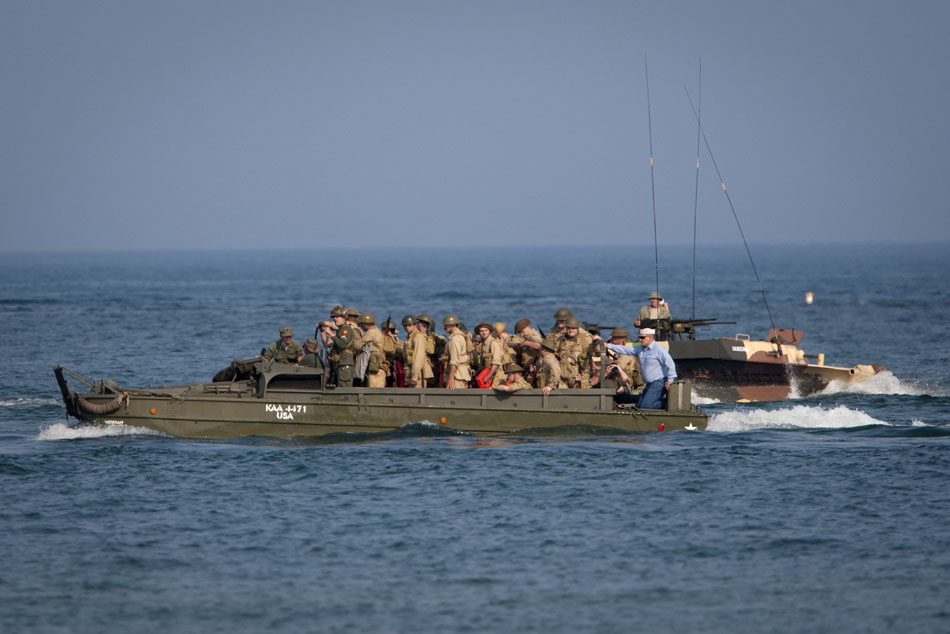 Allied landing crafts circle in the water before invading the beach during a WWII re-enactment on Saturday, June 30, 2012, at Tiscornia Beach in St. Joseph, Mich. (James Brosher/South Bend Tribune)