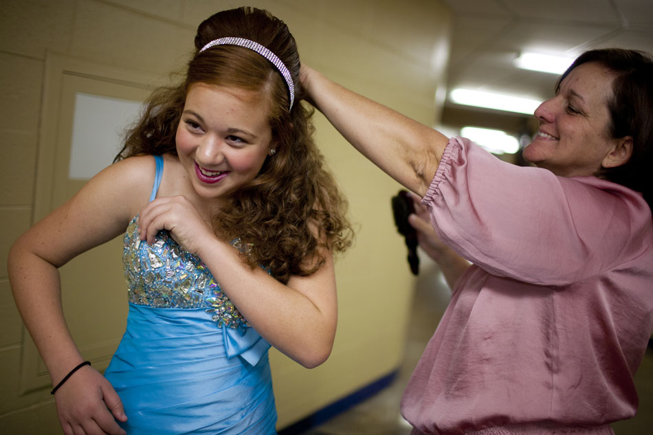 Kelsey Miller, 14, of Monrovia, Calif., shares a laugh with hair stylist Patty Williams as Miller prepares to compete in a beauty pageant during the America's Youth on Parade twirling competition on Monday, July 16, 2012, at Notre Dame. (James Brosher/South Bend Tribune)