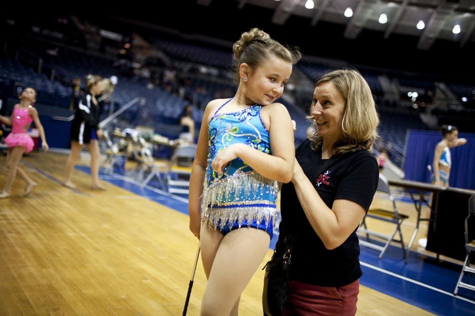 Sharon Shiel performs some "emergency surgery" on an outfit worn by her daughter, Ashley, before the America's Youth on Parade twirling competition on Monday, July 16, 2012, at Notre Dame. The two are from Carmel, N.Y. (James Brosher/South Bend Tribune)