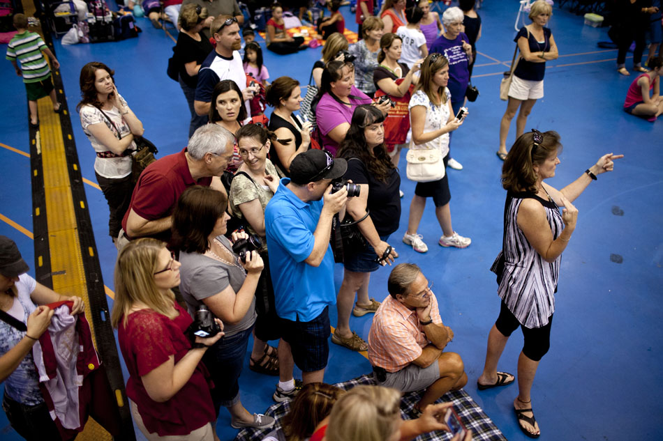 Parents armed with cameras wait as a coach lines up their children for a group photo during the America's Youth on Parade twirling competition on Monday, July 16, 2012, at Notre Dame. (James Brosher/South Bend Tribune)