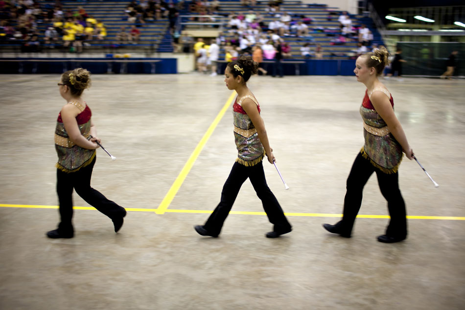Members of the Red Marauders from Willard, Ohio march into the arena for their show during the America's Youth on Parade twirling competition on Monday, July 16, 2012, at Notre Dame. (James Brosher/South Bend Tribune)