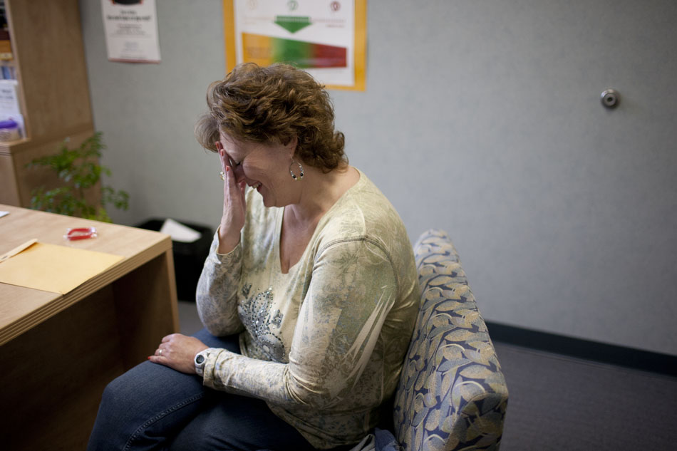 After realizing how much weight she has lost since a previous visit, Kimmie Trethewey starts to cry as she talks with her dietitian on Wednesday, May 9, 2012, at Memorial Weight Loss and Bariatric Surgery Center in Granger. (James Brosher/South Bend Tribune)