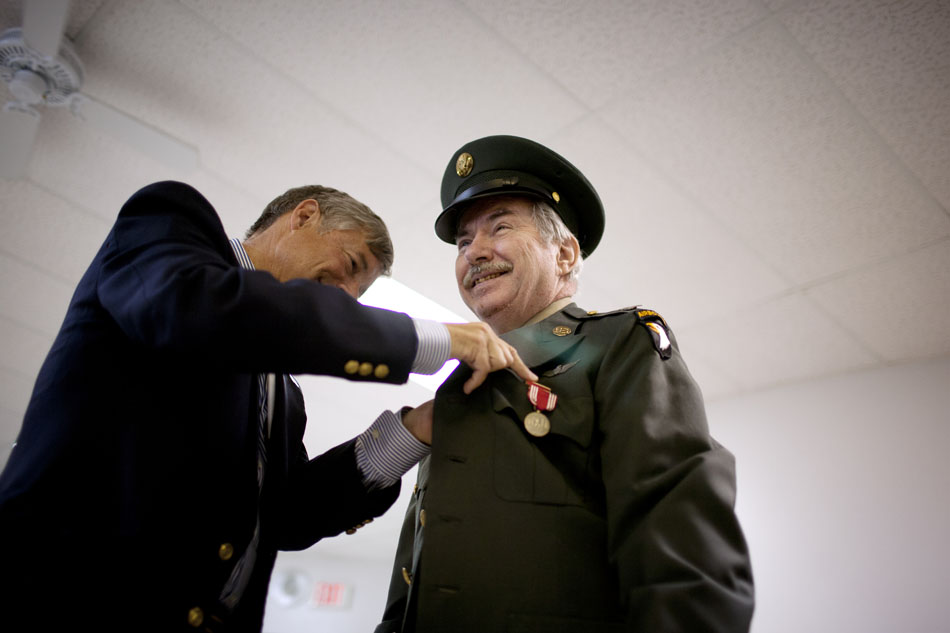 Gordon Oeming shares a smile as U.S. Rep. Fred Upton, R-Mich., pins service medals on Saturday, July 21, 2012, at Silverbrook Manor in Niles, Mich. Oeming volunteered for three tours of duty in the Vietnam War, but never received his medals. (James Brosher/South Bend Tribune)