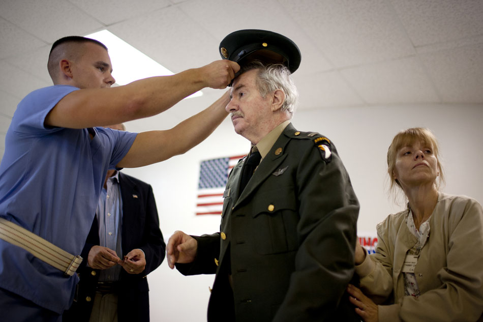 Chris Steele, left, helps Gordon Oeming with his uniform before Oeming received medals for his service in the Vietnam War on Saturday, July 21, 2012, at Silverbrook Manor in Niles, Mich. (James Brosher/South Bend Tribune)